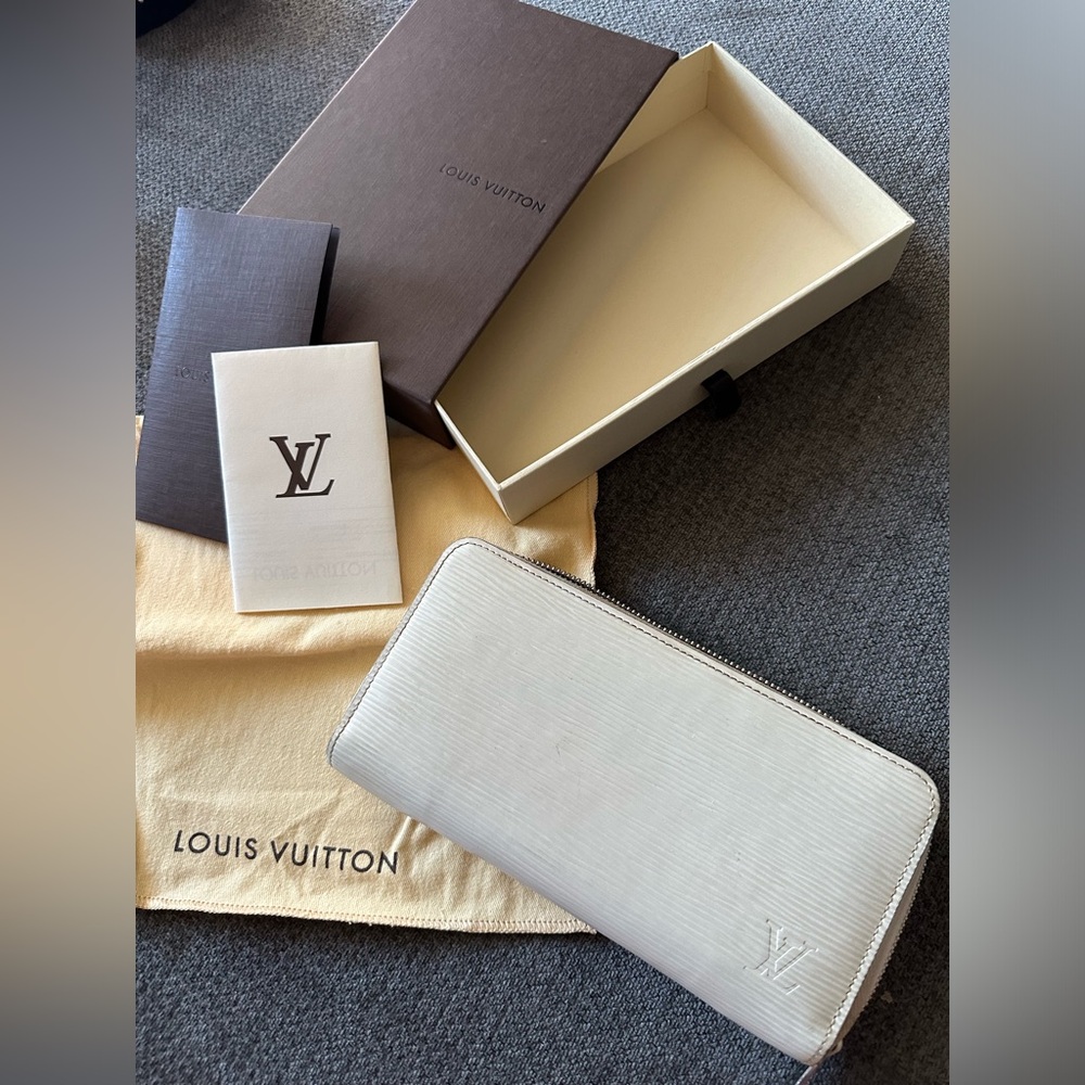 Cream EPI leather Louis Vuitton zip wallet